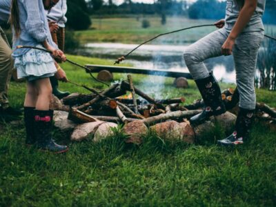 A Family Roasting Marshmallows on a Campfire