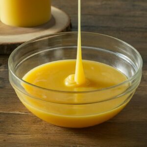 melted beeswax in a glass bowl